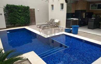 Imagem: A casa possui 4 Dormitórios, 4 Banheiros, 4 Vagas na garagem