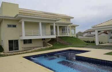 Imagem: A casa em condomínio possui 5 Dormitórios, 5 Banheiros, 5