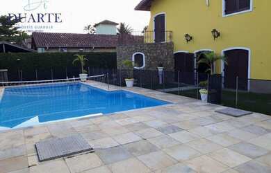 Imagem: A casa possui 5 Dormitórios, 2 Banheiros, 4 Vagas na garagem