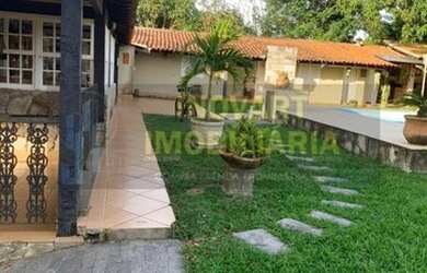 Imagem: A casa possui 5 Dormitórios, 4 Banheiros, 5 Vagas na garagem