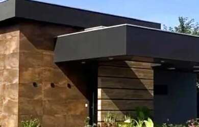 Imagem: A casa em condomínio possui 4 Dormitórios, 5 Banheiros, 600m²