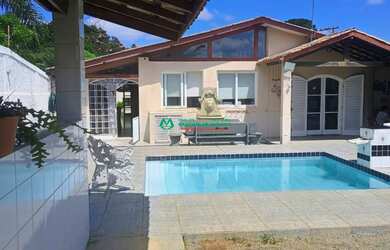 Imagem: A casa em condomínio possui 3 Dormitórios, 3 Banheiros e 350m²