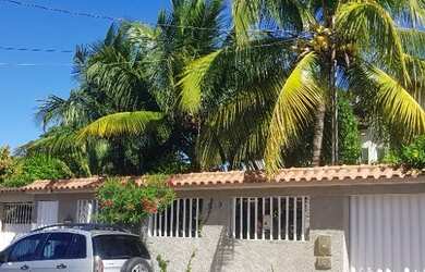 Imagem: A casa possui 4 Dormitórios, 3 Vagas na garagem e está localizado