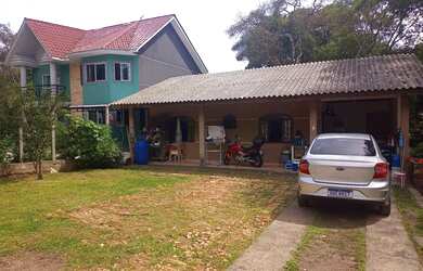 Imagem: A casa possui 3 Dormitórios, 1 Banheiro, 1 Vaga na garagem