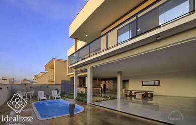 Imagem: A casa possui 3 Dormitórios, 3 Banheiros, 3 Vagas na garagem