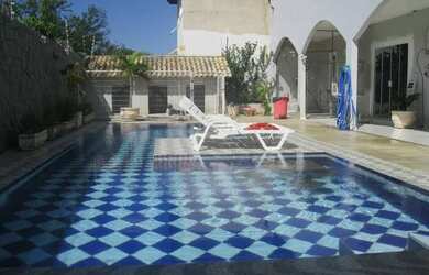 Imagem: A casa em condomínio possui 5 Dormitórios, 4 Banheiros, 2