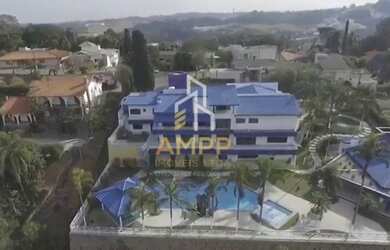 Imagem: A casa possui 5 Dormitórios, 5 Banheiros, 5 Vagas na garagem