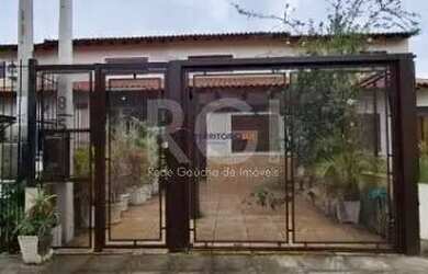 Imagem: A casa possui 2 Dormitórios, 3 Banheiros, 1 Vaga na garagem