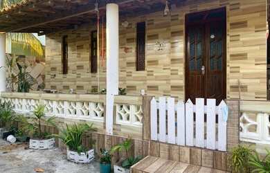 Imagem: A casa possui 3 Dormitórios, 3 Banheiros, 3 Vagas na garagem