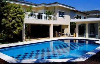 Imagem: A casa possui 5 Dormitórios, 5 Banheiros, 4 Vagas na garagem