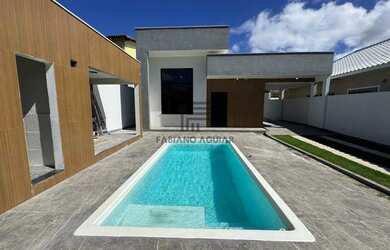 Imagem: A casa possui 3 Dormitórios, 4 Banheiros, 5 Vagas na garagem