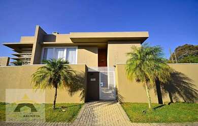 Imagem: A casa possui 4 Dormitórios, 5 Banheiros, 5 Vagas na garagem