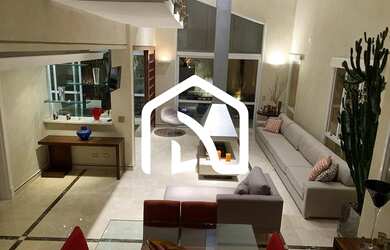 Imagem: A casa possui 4 Dormitórios, 5 Banheiros, 4 Vagas na garagem