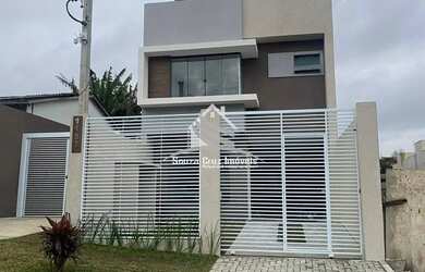 Imagem: A casa possui 3 Dormitórios, 3 Banheiros, 2 Vagas na garagem