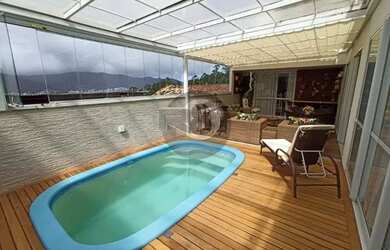 Imagem: A casa possui 4 Dormitórios, 4 Banheiros, 4 Vagas na garagem