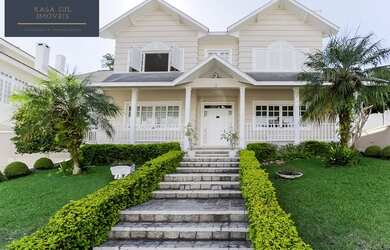 Imagem: A casa possui 4 Dormitórios, 5 Banheiros, 5 Vagas na garagem