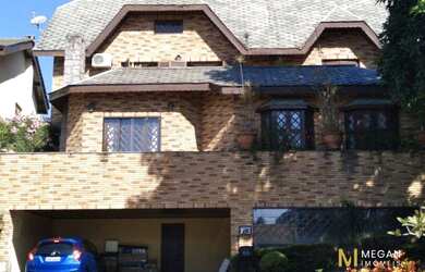 Imagem: A casa possui 5 Dormitórios, 5 Banheiros, 5 Vagas na garagem