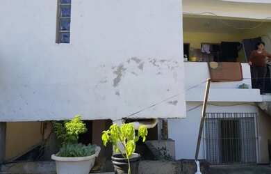 Imagem: A casa possui 4 Dormitórios, 3 Banheiros, 2 Vagas na garagem