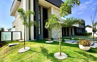 Imagem: A casa possui 4 Dormitórios, 5 Banheiros, 5 Vagas na garagem