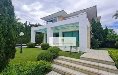 Imagem: A casa possui 5 Dormitórios, 5 Banheiros, 4 Vagas na garagem