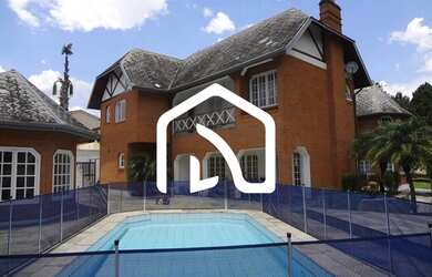 Imagem: A casa possui 4 Dormitórios, 5 Banheiros, 5 Vagas na garagem