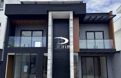 Imagem: A casa possui 3 Dormitórios, 5 Banheiros, 5 Vagas na garagem