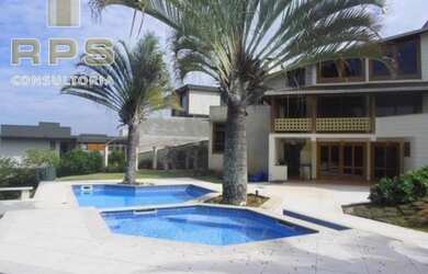 Imagem: A casa possui 4 Dormitórios, 4 Banheiros, 5 Vagas na garagem