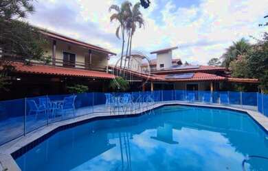 Imagem: A casa possui 5 Dormitórios, 4 Banheiros, 5 Vagas na garagem