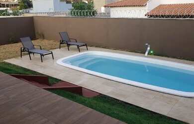 Imagem: A casa possui 3 Dormitórios, 4 Banheiros, 97m² de Área, Piscina