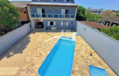 Imagem: A casa possui 5 Dormitórios, 5 Banheiros, 5 Vagas na garagem