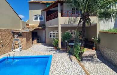 Imagem: A casa possui 4 Dormitórios e 3 Banheiros e está localizado