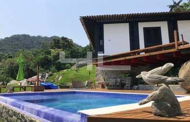 Imagem: A casa em condomínio possui 5 Dormitórios, 5 Banheiros, 5