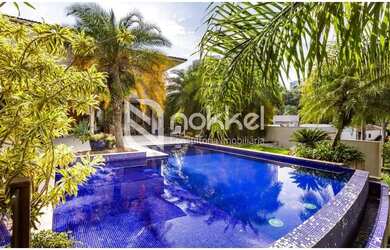 Imagem: A casa possui 5 Dormitórios, 5 Banheiros, 5 Vagas na garagem