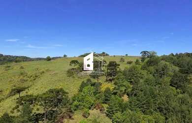 Imagem 2: Área rural com 67 ha, casas, açude e pinus