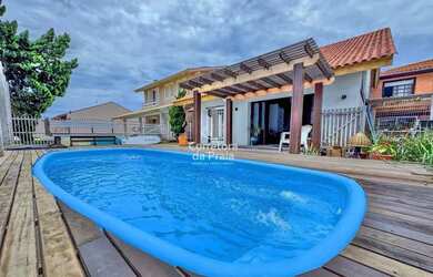 Imagem: A casa possui 5 Dormitórios, 5 Banheiros, 4 Vagas na garagem