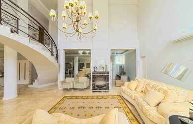 Imagem: A casa em condomínio possui 4 Dormitórios, 4 Banheiros, 3