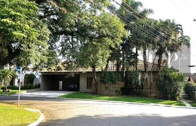 Imagem: A casa possui 4 Dormitórios, 5 Banheiros, 5 Vagas na garagem