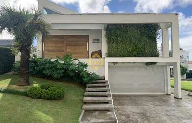 Imagem: A casa em condomínio possui 4 Dormitórios, 5 Banheiros, 4