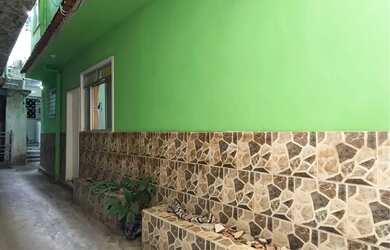 Imagem: A casa possui 3 Dormitórios e 2 Banheiros e está localizado