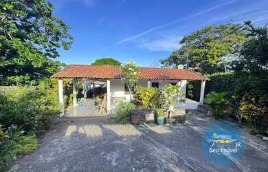 Imagem: A casa possui 4 Dormitórios, 2 Banheiros, 2 Vagas na garagem