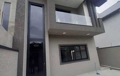 Imagem: A casa possui 3 Dormitórios, 2 Banheiros, 2 Vagas na garagem