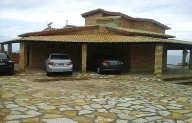 Imagem: A casa possui 4 Dormitórios, 5 Banheiros, 5 Vagas na garagem