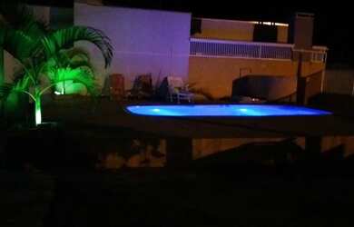 Imagem: A casa possui 4 Dormitórios e 5 Vagas na garagem e está localizado