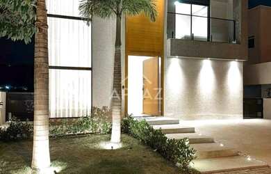 Imagem: A casa possui 4 Dormitórios, 5 Banheiros, 4 Vagas na garagem