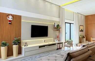 Imagem: A casa possui 3 Dormitórios, 5 Banheiros, 3 Vagas na garagem