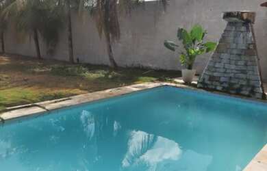 Imagem: A casa possui 5 Dormitórios, 5 Banheiros, 5 Vagas na garagem