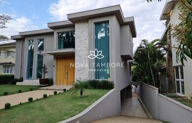 Imagem: A casa em condomínio possui 5 Dormitórios, 5 Banheiros, 5