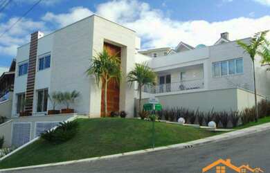 Imagem: A casa possui 5 Dormitórios, 5 Banheiros, 5 Vagas na garagem