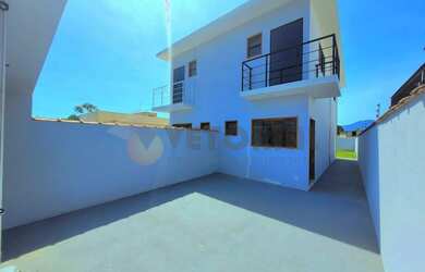 Imagem: A casa possui 2 Dormitórios, 3 Banheiros, 2 Vagas na garagem