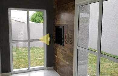 Imagem: A casa possui 3 Dormitórios, 2 Banheiros, 2 Vagas na garagem